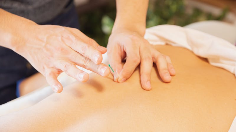 Patient receiving cervical spinal decompression therapy