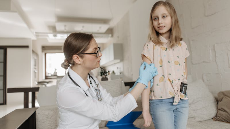Doctor checking a child