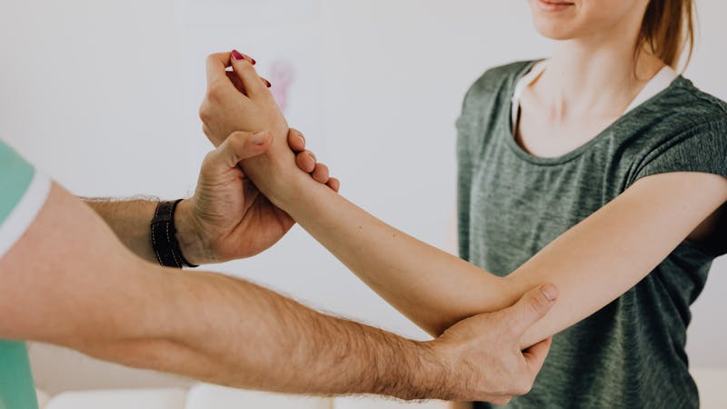 Chiropractor consulting with patient