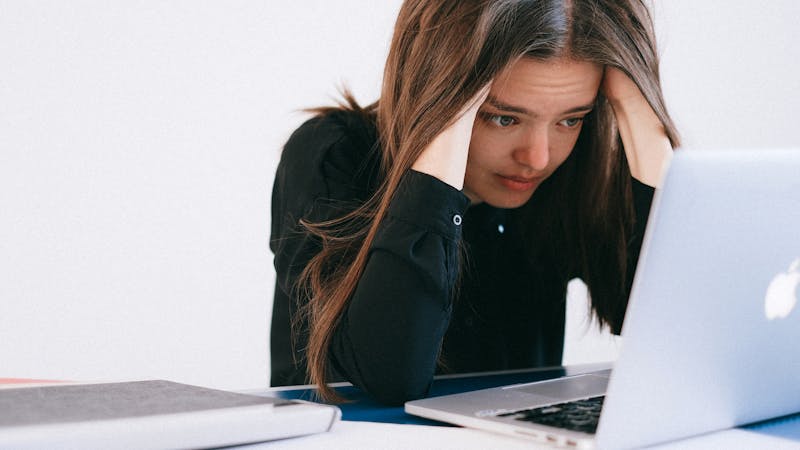Woman with poor posture at desk