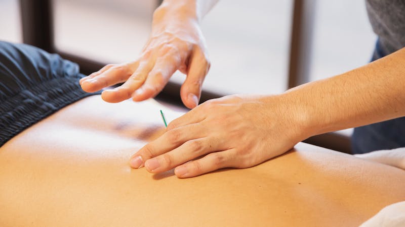 Chiropractor performing routine adjustment