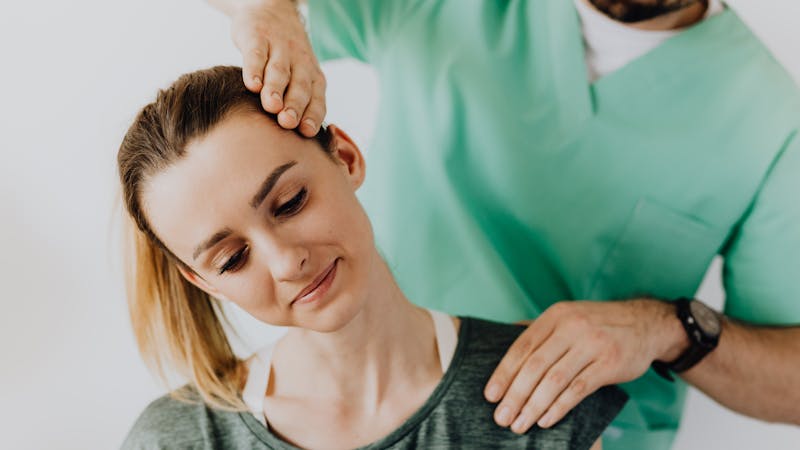 Person experiencing sharp lower back pain