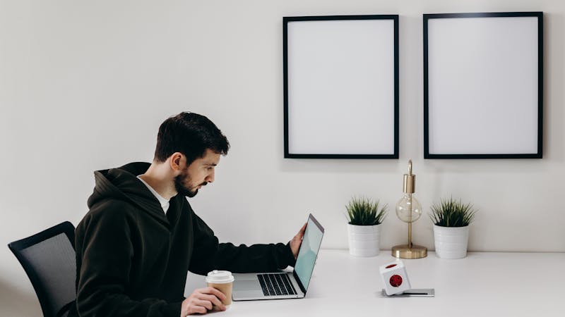 Person working at desk with poor posture