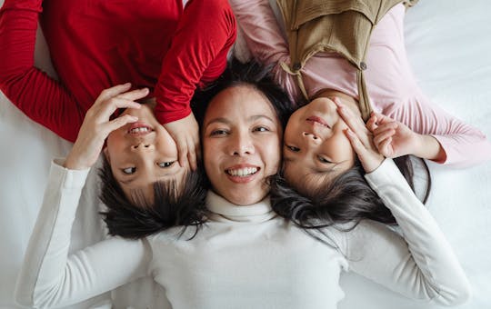 Happy mother with two children representing whole-family wellness care